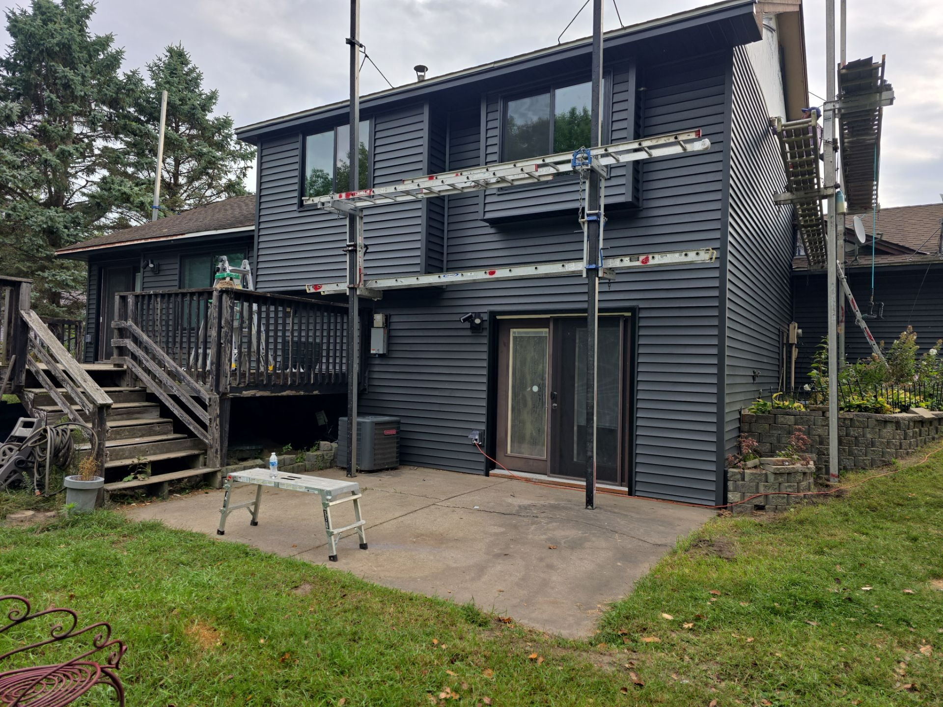 Dark siding installation in progress